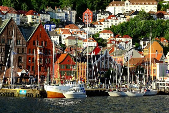 Norwegian fishing village with boats in harbor